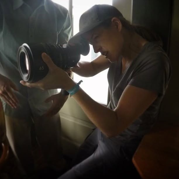 Ashley N. Hudson working behind the camera on set